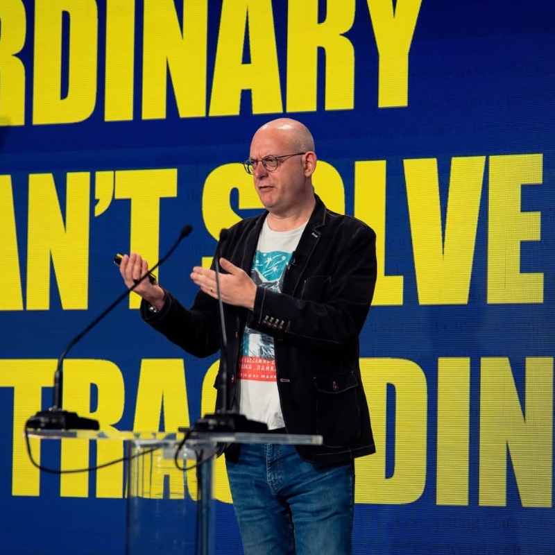 Kevin Chesters presenting on stage